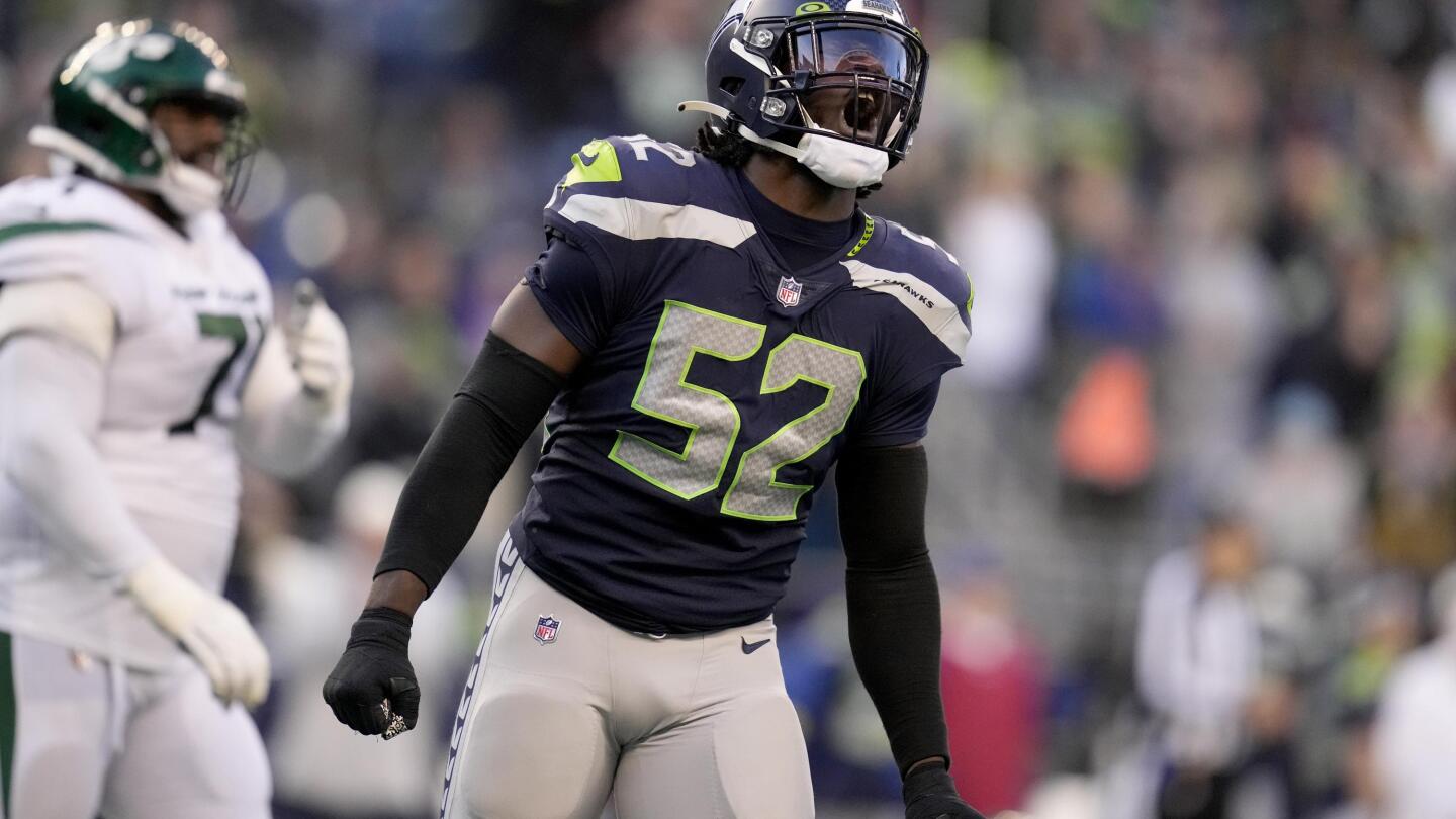 Seattle Seahawks defensive end Darrell Taylor (52) gets set during