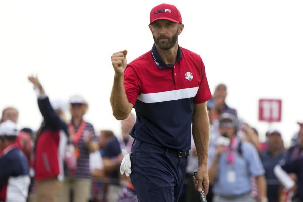 Team USA's Dustin Johnson reacts to his putt on the 15th hole during a Ryder Cup singles match at the Whistling Straits Golf Course Sunday, Sept. 26, 2021, in Sheboygan, Wis. (AP Photo/Charlie Neibergall)