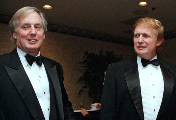 FILE - In this Nov. 3, 1999, file photo, Robert Trump, left, joins then real estate developer and presidential hopeful Donald Trump at an event in New York. President Donald Trump's younger brother, Robert Trump, a businessman known for an even keel that seemed almost incompatible with the family name, died Saturday night, Aug. 15, 2020, after being hospitalized in New York, the president said in a statement. He was 71. The president visited his brother at a New York City hospital Friday after White House officials said Robert Trump had become seriously ill. (AP Photo/Diane Bonadreff, File)