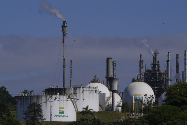 Capuava oil refinery owned by Petrobras sits in Maui, on the outskirts of Sao Paulo, Brazil, Monday, Nov. 6, 2023. The oil and gas sector, one of the major emitters of planet-warming gases, will need a rapid and substantial overhaul for the world to avoid even worse extremes fueled by human-caused climate change, a report Thursday Nov. 23, said. (AP Photo/Andre Penner)