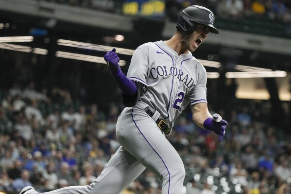 Colorado Rockies' Nolan Jones reacts after hitting a home run during the seventh inning of a baseball game against the Milwaukee Brewers Tuesday, Aug. 8, 2023, in Milwaukee. (AP Photo/Morry Gash)