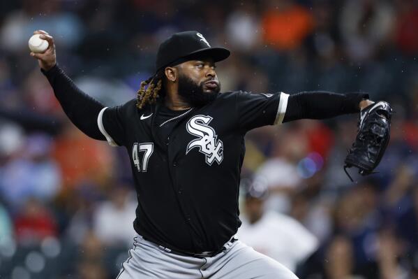 Chicago White Sox starting pitcher Johnny Cueto delivers against the Cleveland Guardians during the first inning of a baseball game Saturday, Aug. 20, 2022, in Cleveland. (AP Photo/Ron Schwane)