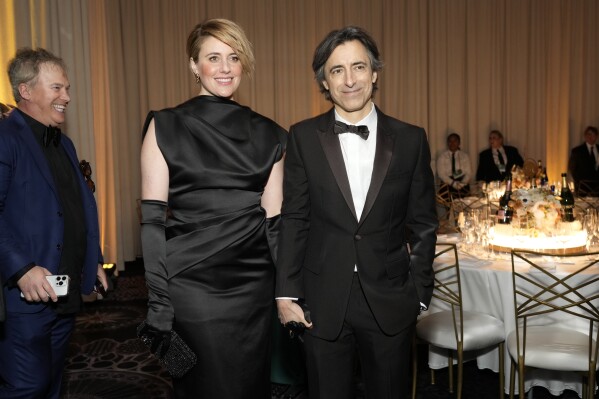 Greta Gerwig, left, and Noah Baumbach arrive at the 81st Golden Globe Awards on Sunday, Jan. 7, 2024, at the Beverly Hilton in Beverly Hills, Calif. (AP Photo/Chris Pizzello)