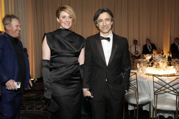 Greta Gerwig, left, and Noah Baumbach arrive at the 81st Golden Globe Awards at the Beverly Hilton on Sunday, January 7, 2024 in Beverly Hills, California.  (AP Photo/Chris Pizzello)