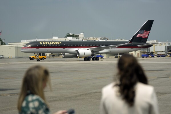 The plane carrying former President Donald Trump arrives at Ronald Reagan Washington National Airport, Thursday, Aug. 3, 2023, in Arlington, Va., as he heads to Washington to face a judge on federal conspiracy charges alleging Trump conspired to subvert the 2020 election. (AP Photo/Alex Brandon)