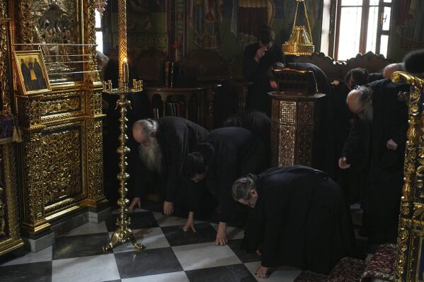 Monks attend afternoon prayers at Simonopetra, or the Simonos Petra Monastery, home of the all-male autonomous community Agion Oros, or Holy Mountain, on the peninsula of Mount Athos in northern Greece, April 14, 2025. (AP Photo/Thanassis Stavrakis)