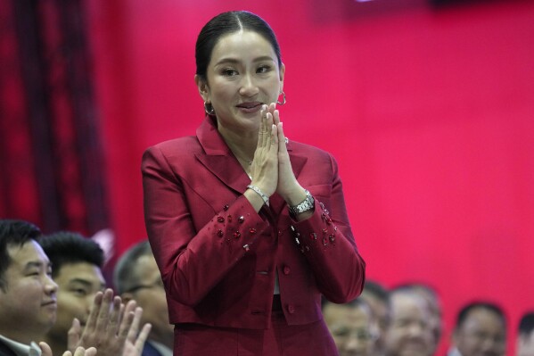 New leader of Pheu Thai Party, Paetongtarn Shinawatra, daughter of Thailand's former Prime Minister Thaksin Shinawatra, offers a traditional greeting known as a 