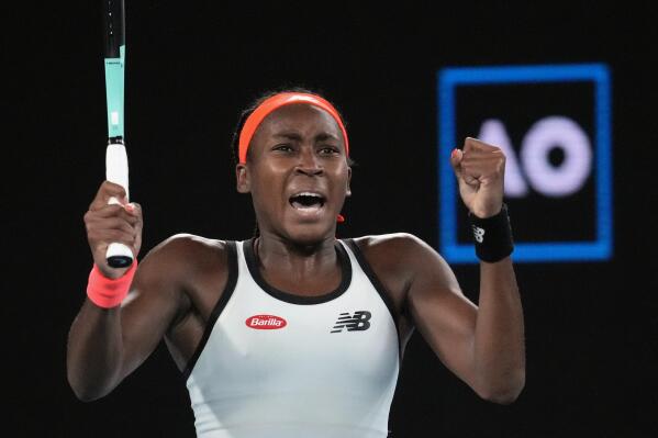 Coco Gauff of the U.S. celebrates after defeating Emma Raducanu of Britain in their second round match at the Australian Open tennis championship in Melbourne, Australia, Wednesday, Jan. 18, 2023. (AP Photo/Dita Alangkara)