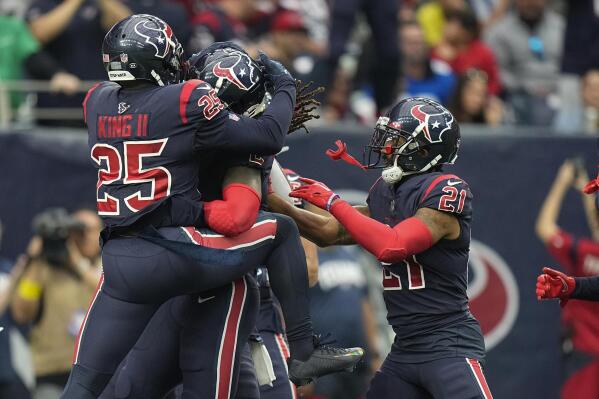 Cleveland Browns DESHAUN WATSON (4) escapes Houston Texans defenders during  the game between the Cleveland Browns and the Houston Texans in Houston,  Texas at NRG Stadium on December 4, 2022. The Cleveland