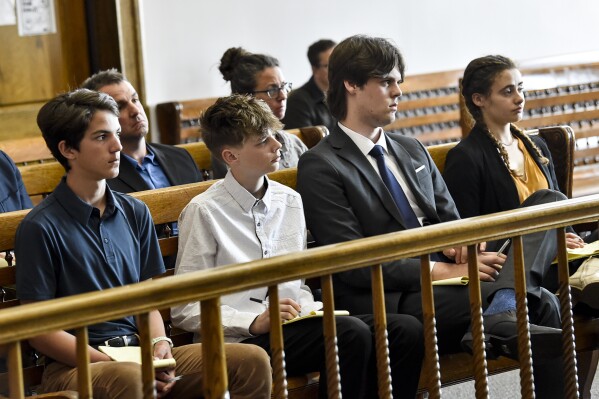 FILE - Plaintiffs in a climate lawsuit brought by children and young adults in Montana listen to arguments during a May 12, 2023, court hearing in Helena, Mont. The office of Montana's Republican attorney general is appealing a landmark ruling in the case from a state judge who said officials weren’t doing enough to protect the plaintiffs from the harms of global warming. (Thom Bridge/Independent Record via AP, file)