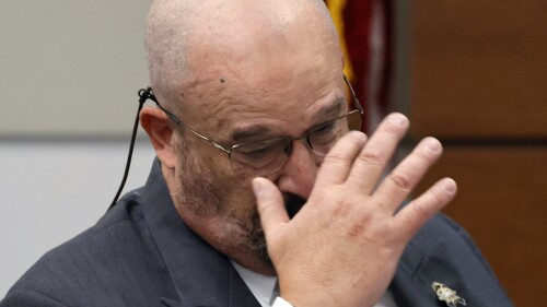 Broward Sheriff's Office Detective John Curcio becomes emotional while testifying during the trial of former Marjory Stoneman Douglas High School School Resource Officer Scot Peterson at the Broward County Courthouse in Fort Lauderdale, Fla., on Wednesday, June 21, 2023. Broward County prosecutors charged Peterson, a former Broward Sheriff's Office deputy, with criminal charges for failing to enter the 1200 Building at the school and confront the shooter. (Amy Beth Bennett/South Florida Sun-Sentinel via AP, Pool)
