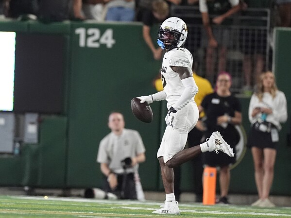 Colorado wide receiver Travis Hunter celebrates after intercepting a pass from Colorado State quarterback Brayden Fowler-Nicolosi in the second half of an NCAA college football game Saturday, Sept. 14, 2024, in Fort Collins, Colo. (AP Photo/David Zalubowski, File)