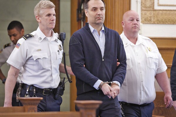 FILE - Brian Walshe enters the courtroom for his arraignment, April 27, 2023, in Dedham, Mass. Walshe, a Massachusetts man charged with killing his wife, was sentenced Tuesday, Feb. 20, 2024, to more than three years in jail over an unrelated art fraud case involving the sale of two fake Andy Warhol paintings. (Greg Derr/The Patriot Ledger via AP, Pool, File)