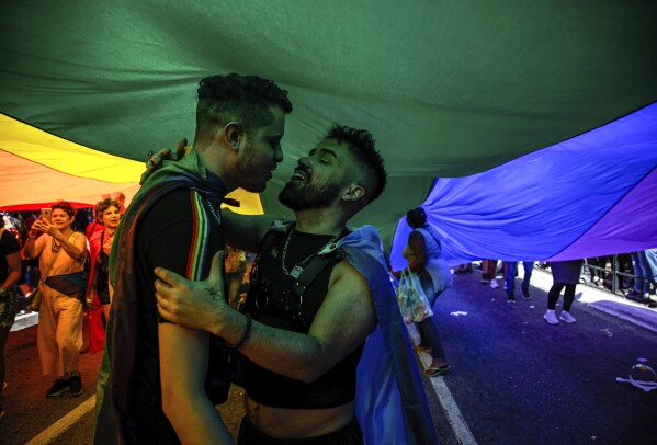 Participants take part in the annual Gay Pride Parade in Sao Paulo, Brazil, Sunday, June 11, 2023. (AP Photo/Tuane Fernandes)