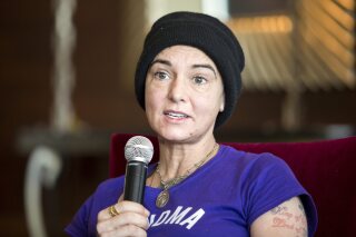 FILE - Irish singer-songwriter Sinead O'Connor attends a press event during the Budapest Spring Festival at a hotel in Budapest, Hungary, on April 22, 2015. A coroner says Irish singer-songwriter Sinéad O’Connor died from “natural causes” in July. London’s Metropolitan Police had said the singer’s death was not considered suspicious after she was found unresponsive at a home in southeast London on July 26. O’Connor was 56. The Southwark Coroner’s Court confirmed that O’Connor died of natural causes.(Balazs Mohai/MTI via AP)