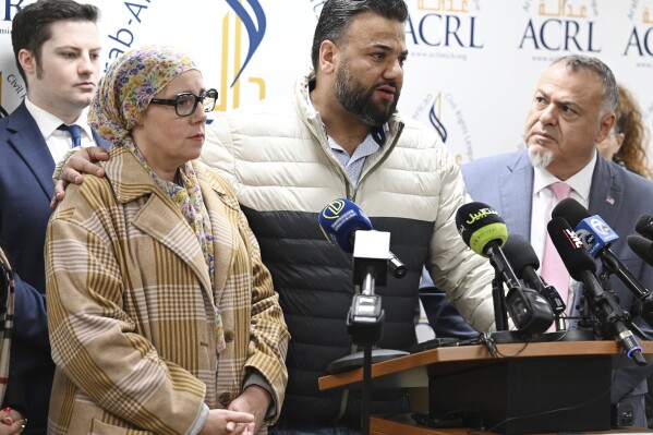 Yahya Alarayshi, center, and his wife Lisa Alarayshi, left, of Canton, Mich., speak about the safe return of his parents, Zakaria Alarayshi and Laila Alarayshi, from Gaza, during a press conference at the Arab American Civil Rights League office, Wednesday, Nov. 8, 2023, in Dearborn, Mich. (Clarence Tabb Jr./Detroit News via AP)