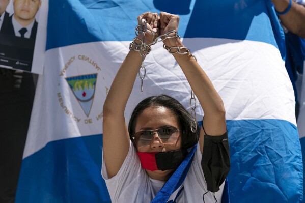 FILE - Nicaragua supporters protest outside of the Organization of the American States asking that political prisoners be freed and against the government's human rights violations, during a rally in Washington, June 23, 2021. Nicaragua has increased human rights violations and persecution of the opposition as it ratchets up its efforts to stifle dissent, a United Nations group of experts monitoring the country said Tuesday, Sept. 12, 2023. (AP Photo/Jose Luis Magana, File)