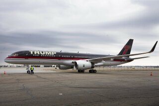 
              FILE - In this March 1, 2016 file photo, Republican presidential candidate Donald Trump's private jet arrives at Port-Columbus International Airport, in Columbus, Ohio. President Don...