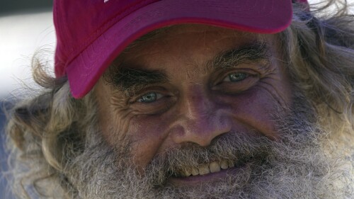 Australian Timothy Lyndsay Shaddock smiles as he speaks during a welcoming ceremony by Grupo Mar after being rescued from sea and arriving to port in Manzanillo, Mexico, Tuesday, July 18, 2023. After being adrift with his dog for three months, the pair were rescued by the Mexican tuna boat "Maria Delia," owned by Grupo Mar, from his incapacitated catamaran in the Pacific Ocean some 1,200 miles from land. (AP Photo/Fernando Llano)