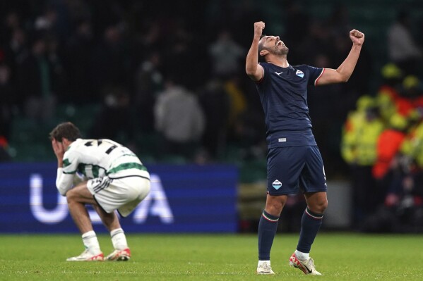 Lazio's Pedro, right, celebrates scoring a goal at the Champions League Group E soccer match between Celtic and Lazio at Celtic Park, Glasgow, Scotland, Wednesday, Oct. 4, 2023. (Andrew Milligan/PA via AP)