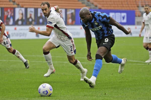 Cagliari's Diego Godin, left, and Inter Milan's Romelu Lukaku vie for the ball during a Serie A soccer match between Inter Milan and Cagliari at the San Siro stadium in Milan, Italy, Sunday, April ...