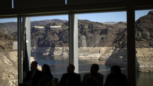 FILE - Officials listen during a news conference on Lake Mead at the Hoover Dam Tuesday, April 11, 2023, near Boulder City, Nev. Arizona, California and Nevada said on Monday, May 23, 2023, that they have reached an agreement to cut their use of the Colorado River in exchange for federal money. (AP Photo/John Locher, File)