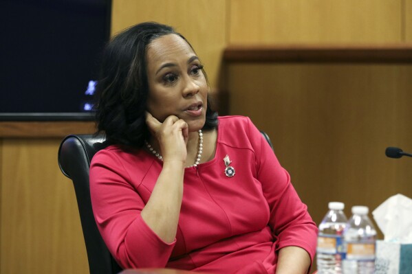 Fulton County District Attorney Fani Willis testifies during a hearing on the Georgia election interference case, Thursday, Feb. 15, 2024, in Atlanta. The hearing is to determine whether Willis should be removed from the case because of a relationship with Nathan Wade, special prosecutor she hired in the election interference case against former President Donald Trump. (Alyssa Pointer/Pool Photo via AP)