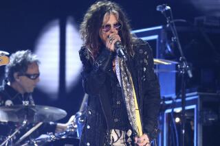 FILE - Steven Tyler, of the musical group Aerosmith, performs at the 62nd annual Grammy Awards in Los Angeles on Jan. 26, 2020. Tyler has voluntarily entered a rehabilitation program, forcing the Boston-based rock band to cancel the first portion of its upcoming Las Vegas residency. (Photo by Matt Sayles/Invision/AP, File)