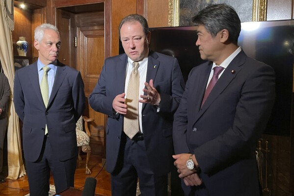 U.S. Ambassador to Japan Rahm Emanuel, left, Ukraine Ambassador to Japan Sergey Korsunsky, center, and acting secretary general of the governing Liberal Democratic Party Seiji Kihara speak to the media in Tokyo, Japan, Thursday Dec. 7, 2023. (APPhoto/Mari Yamaguchi)