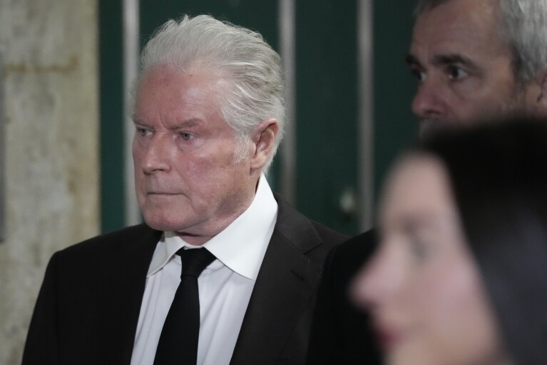 Musician Don Henley returns to court after a break in New York, Tuesday, Feb. 27, 2024. Henley resumed testimony Tuesday in a trial over handwritten drafts of lyrics to some of the Eagles' biggest hits , including “Hotel California," and his decade-long effort to recover the pages.  (AP Photo/Seth Wenig)