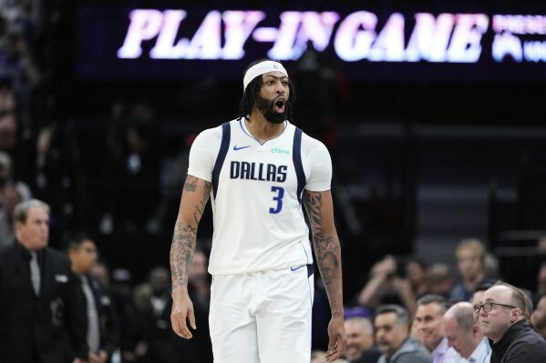 Dallas Mavericks forward Anthony Davis (3) reacts during the first half of an NBA play-in tournament basketball game against the Sacramento Kings, Wednesday, April 16, 2025, in Sacramento, Calif. (AP Photo/Godofredo A. Vásquez)