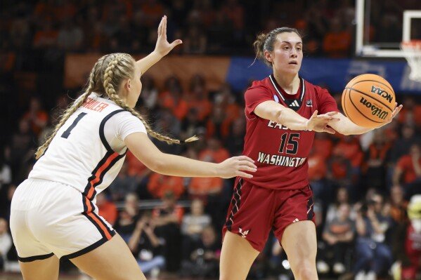 Eastern Washington guard Jamie Loera (15) passes the ball away from Oregon State guard Kennedie Shuler (1) during the first half of a first-round college basketball game in the women's NCAA Tournament in Corvallis, Ore., Friday, March 22, 2024. (AP Photo/Amanda Loman)