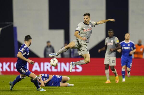 Salzburg's Lucas Gourna-Douath jumps for the ball during the Champions League group E soccer match between Dinamo Zagreb and Salzburg at the Maksimir stadium, in Zagreb, Croatia, Tuesday, Oct. 11, 2022. (AP Photo/Darko Bandic)