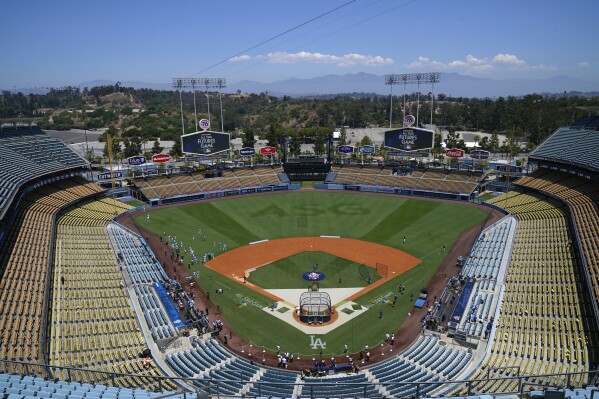 FILE - Dodger Stadium is viewed before the MLB All-Star Futures baseball game July 16, 2022, in Los Angeles. A viral aerial video of the stadium taken after the heavy downpour from Tropical Storm Hilary has many social media users convinced that floodwaters submerged the ballpark. But the team says it was never underwater. (AP Photo/Jae C. Hong, File)