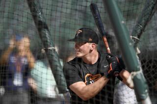 FILE - In this June 25, 2019, file photo, Baltimore Orioles first-round draft pick Adley Rutschman takes batting practice before a baseball game against the San Diego Padres in Baltimore. The Orioles called Rutschman up to the majors Saturday, May 21, 2022, paving the way for the 24-year-old catcher to make his big league debut. (AP Photo/Nick Wass, File)