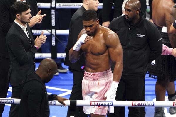 Anthony Joshua celebrates after winning a heavyweight boxing match against Jermaine Franklin at The O2, Saturday, April 1, 2023 in London. (Zac Goodwin/PA via AP)