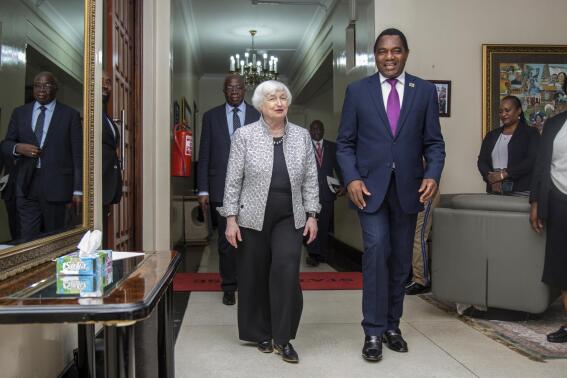 U.S. Treasury Secretary Janet Yellen, left, walks with Zambia's President Hakainde Hichilema during their meeting at the State House in Lusaka, Zambia, Jan. 23, 2023. (AP Photo/Salim Dawood)