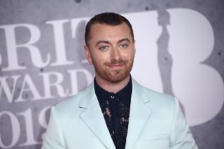 File-This Feb. 20, 2019, file photo shows singer Sam Smith posing for photographers upon arrival at the Brit Awards in London. The Oscar-winning pop star has declared his pronouns “they/them” on social media after coming out as non-binary in his “lifetime of being at war with my gender.” The English “Too Good at Goodbyes” singer said Friday, Sept. 13, 2019, he’s decided to “embrace myself for who I am, inside and out ...” (Photo by Joel C Ryan/Invision/AP, File)