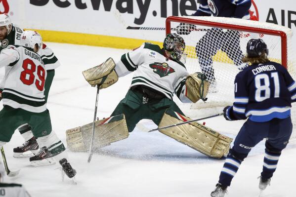 Minnesota Wild's Marc-Andre Fleury (29) saves the shot from Winnipeg Jets' Kyle Connor (81) during the first period of an NHL hockey game, Wednesday, March 8, 2023 in Winnipeg, Manitoba. (John Woods/The Canadian Press via AP)