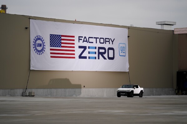 President Joe Biden test drives a Hummer at the General Motors Factory ZERO electric vehicle assembly plant during a tour, Nov. 17, 2021, in Detroit.