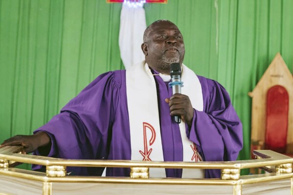 Bishop John Wesley Yohanna of the United Methodist Church delivers a message to church members Dec. 10, 2023, at the church's headquarters in Jalingo, Nigeria, during a celebration of 100 years of Methodism in the country. The bishop invited the congregation to remember the early missionaries and the sacrifices they made. But separately, he has said the Nigeria church may split from the denomination over differences on ordination of LGBTQ people and same-sex marriage. (Ezekiel Ibrahim Maisamari/UM News via AP)