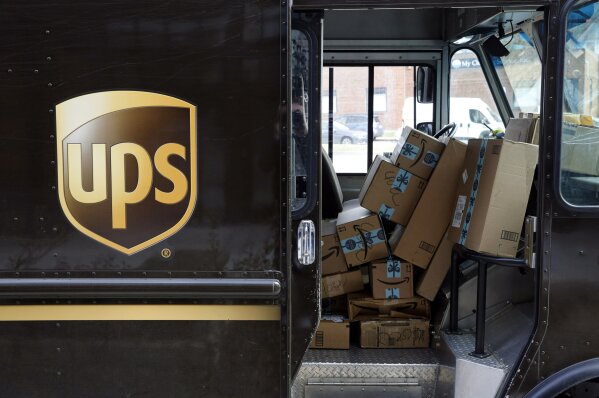 Packages await delivery inside of a UPS truck, Wednesday, Dec. 19, 2018, in Baltimore.  Shoppers, who can't touch or feel products they're ordering,  are expected to return items during the holiday season at a rate double from last year, costing retailers roughly $1.1 billion, according to Narvar Inc.,  a software and technology company that manages online returns for hundreds of brands.  That puts retailers in a conundrum: they don't want the returns, but they also want to make shoppers feel comfortable to freely buy without worry.(AP Photo/Patrick Semansky)