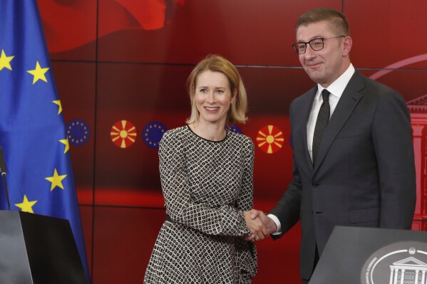 European Union foreign policy chief Kaja Kallas, left, shakes hands with North Macedonia's Prime Minister Hristijan Mickoski, after their joint news conference at the government building in Skopje, North Macedonia, on Friday, May 23, 2025. (AP Photo/Boris Grdanoski)