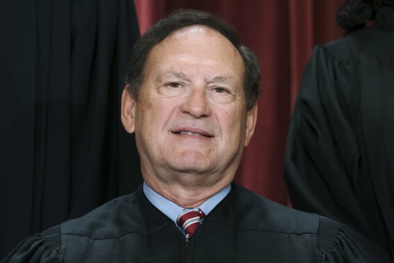 FILE - Associate Justice Samuel Alito joins other members of the Supreme Court as they pose for a new group portrait, Oct. 7, 2022, at the Supreme Court building in Washington. An upside-down American flag, a symbol associated with former President Donald Trump's false claims of election fraud, was displayed outside the home of Supreme Court Justice Samuel Alito in January 2021, The New York Times reported May 16. (AP Photo/J. Scott Applewhite, File)