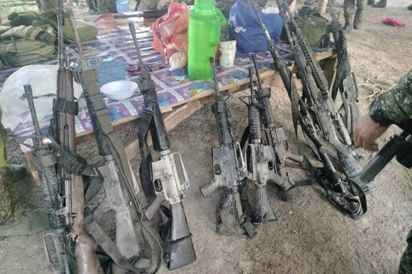 In this handout photo provided by the Philippine Army 6th Infantry Division, recovered firearms from suspected members of the Bangsamoro Islamic Freedom Fighters are seen after a gunbattle with Philippine troops at Datu Saudi Ampatuan town in Maguindanao del Sur province, southern Philippines on Monday April 22, 2024. Philippine troops killed the leader of a small Muslim rebel group and eleven of his men blamed for past bombings and extortion in a clash in the country's south, military officials said Tuesday. (Philippine Army 6th Infantry Division via AP)