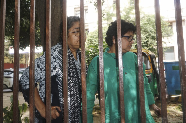 Leaders from India's Trinamool Congress political party, Dola Sen, left, and April Ghosh, talk to the media after being detained while protesting outside the Election Commission's office, in New Delhi, India, Tuesday, April 9, 2024.(AP Photo/Dinesh Joshi)