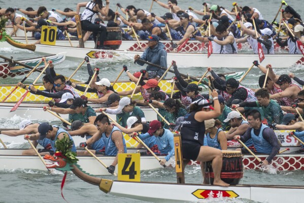 Competitors take part in the Stanley International Dragon Boat Championships to celebrate the Dragon Boat Festival in Hong Kong, Saturday, May 31, 2025. (AP Photo/Chan Long Hei)