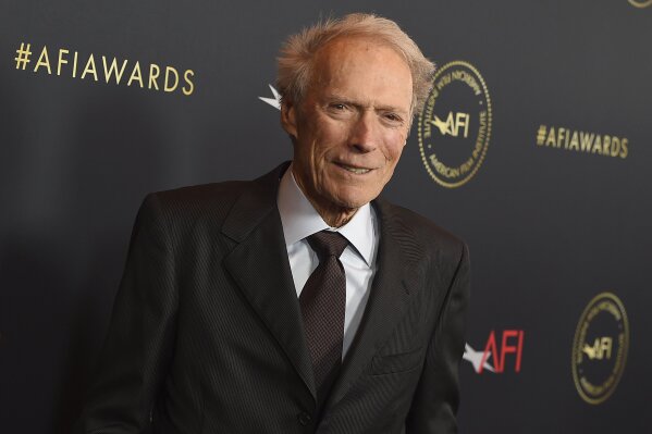 FILE - Clint Eastwood arrives at the AFI Awards on Jan. 3, 2020, in Los Angeles. Eastwood sued several companies that sell CBD supplements Wednesday, alleging that they are falsely using his name and image to push their products. (Photo by Jordan Strauss/Invision/AP, File)