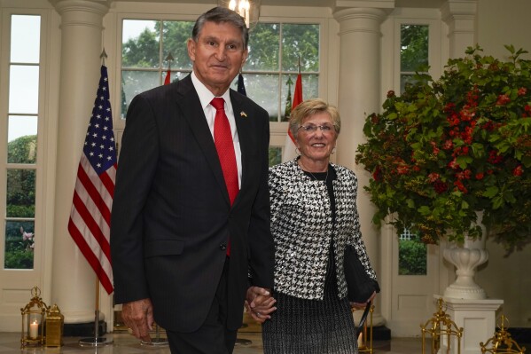 FILE - Sen. Joe Manchin, D-W.Va., and his wife, Gayle Manchin, arrive for the State Dinner at the White House, June 22, 2023, in Washington. An Alabama judge cut bond by nearly $1.9 million on Tuesday, March 12, 2024, for a man accused of fleeing from police during a car chase and causing a crash last January that injured Gayle Manchin and a work colleague. (AP Photo/Jacquelyn Martin, File)