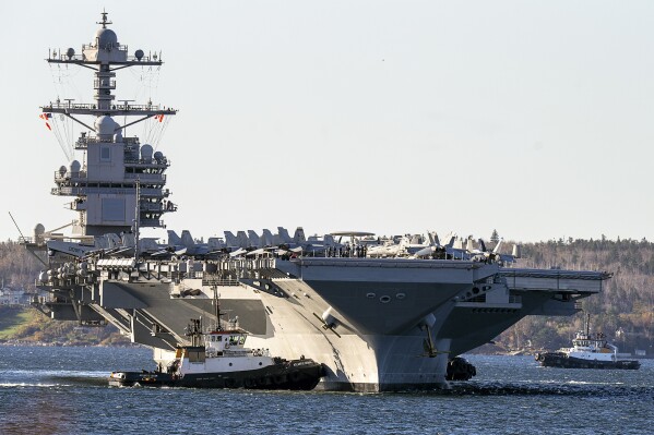 FILE - The USS Gerald R. Ford, arrives in Halifax on Oct. 28, 2022. Within hours of the horrific attack by Hamas, the U.S. began moving warships and aircraft to the region to be ready to provide Israel with whatever it needs to respond.(Andrew Vaughan/The Canadian Press via AP, File)